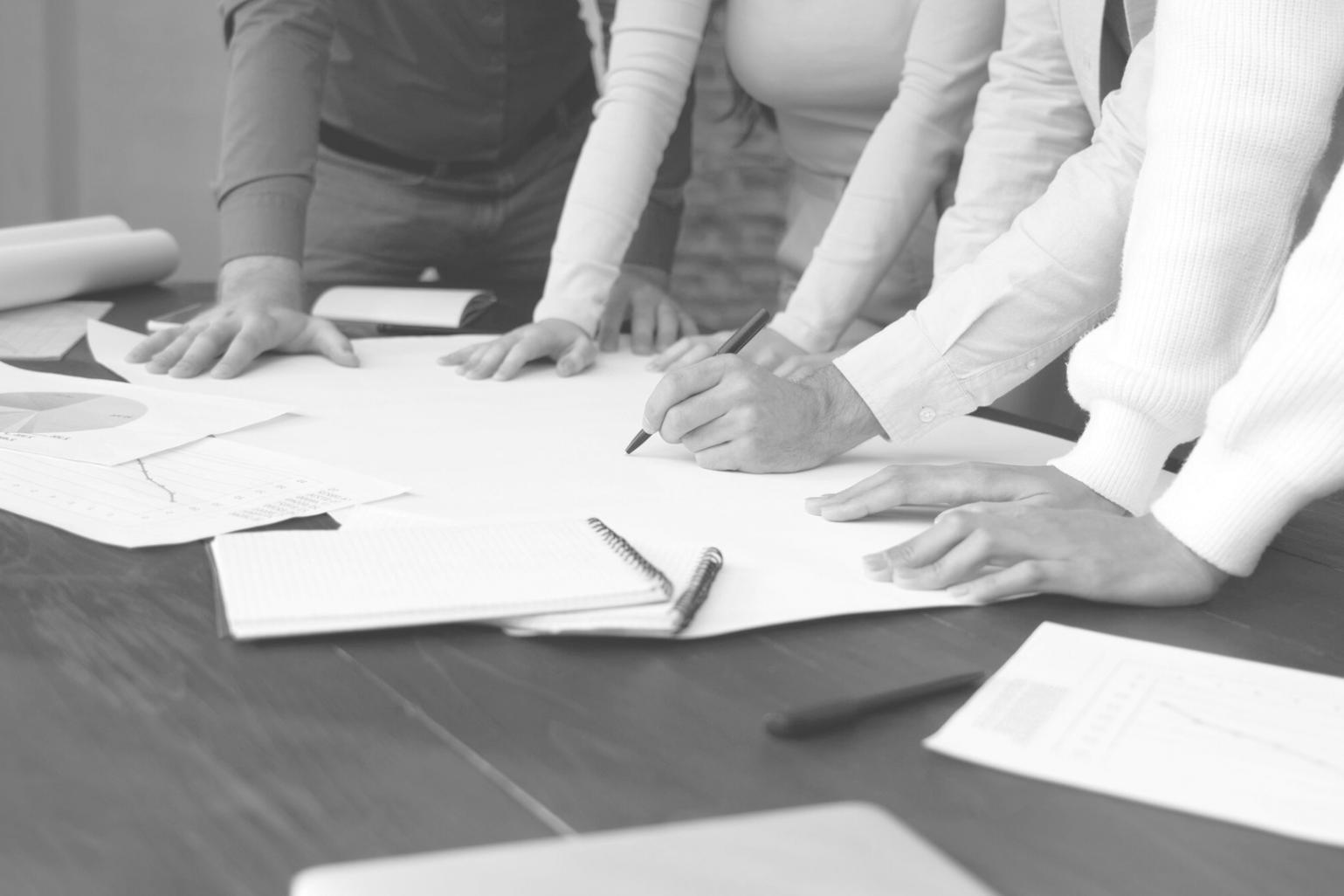 Small group learning session with families discussing investment strategies